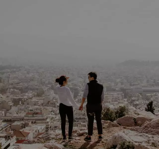 Couple admiring views of Athens from above