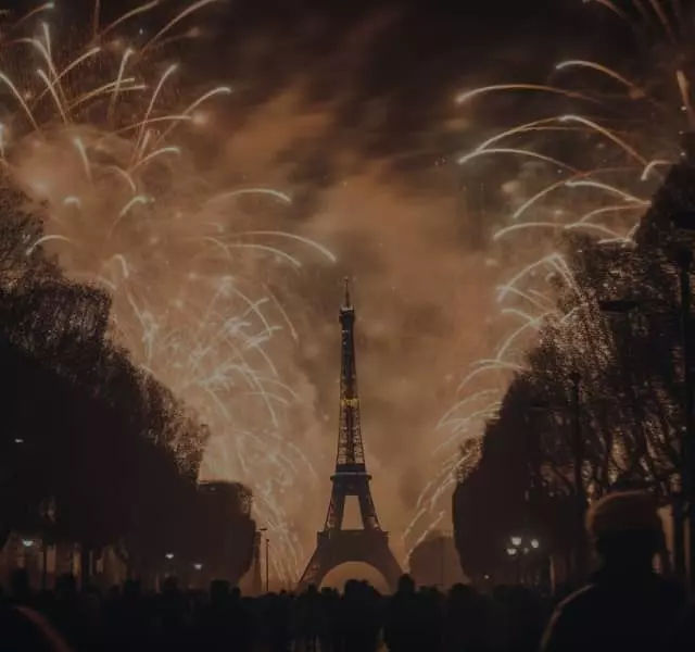 Eiffel Tower at night with fireworks