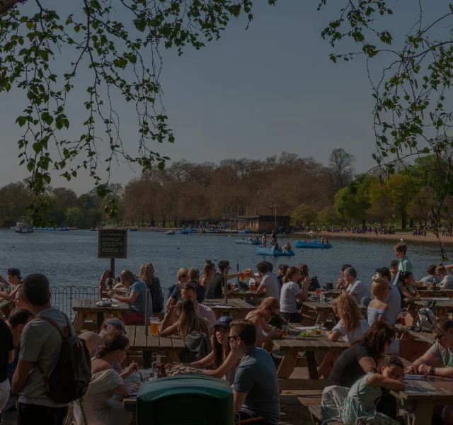 Dining al fresco in the park by the lake in London
